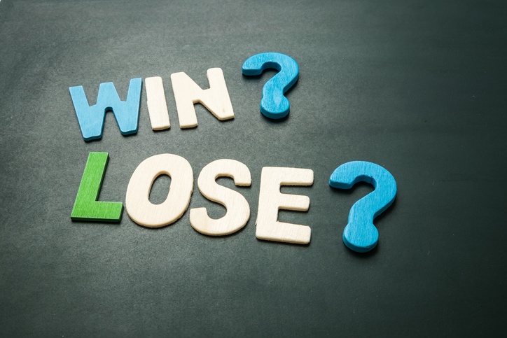 Photo with text spelling out "Win?" and "Lose?"