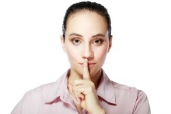 Image of woman telling people to be silent.
